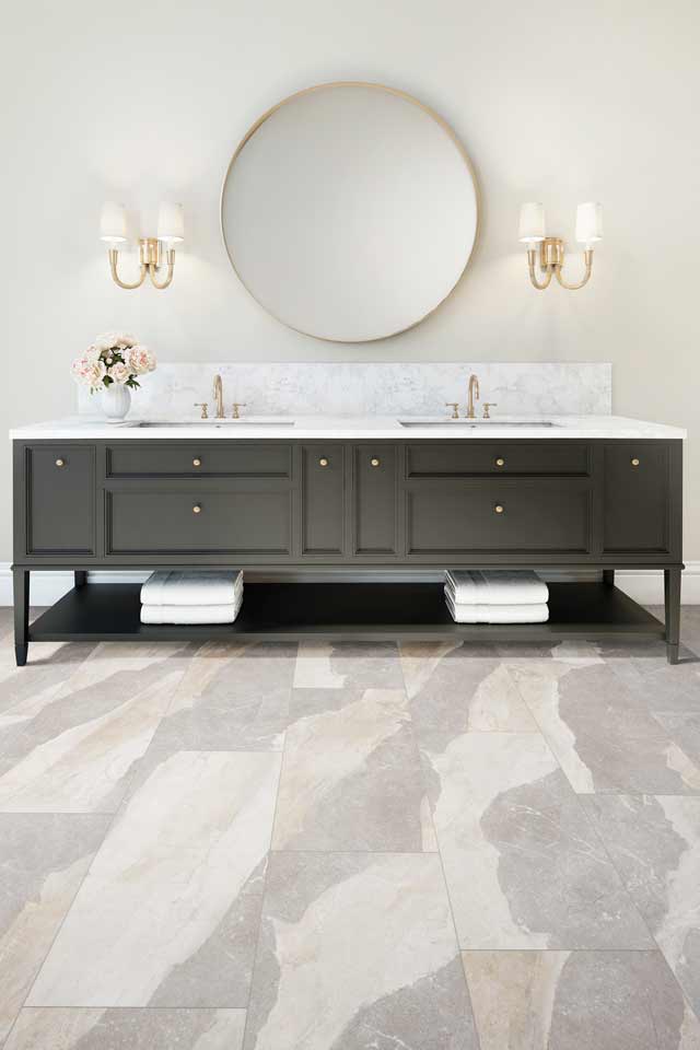 stone look luxury vinyl in modern bathroom with gold accents